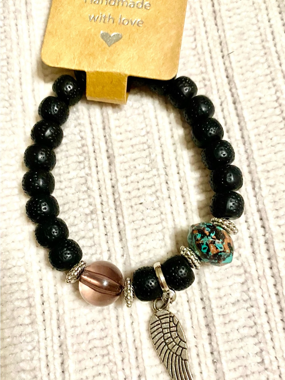 Handmade Black Lava Bead Bracelet with Wing Charm